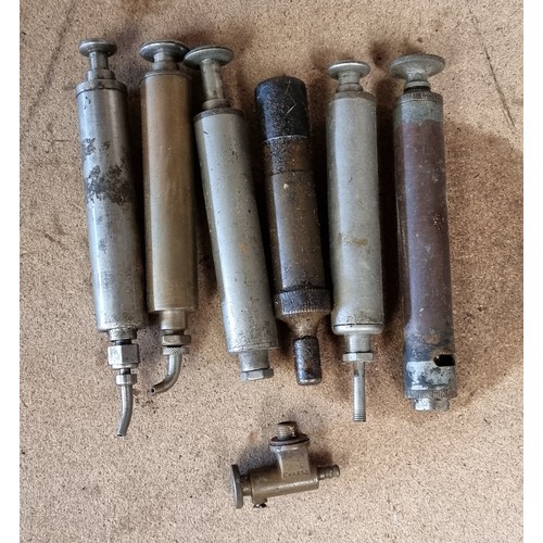 139 - 6 Vintage oil pumps and an Ewarts fuel tap