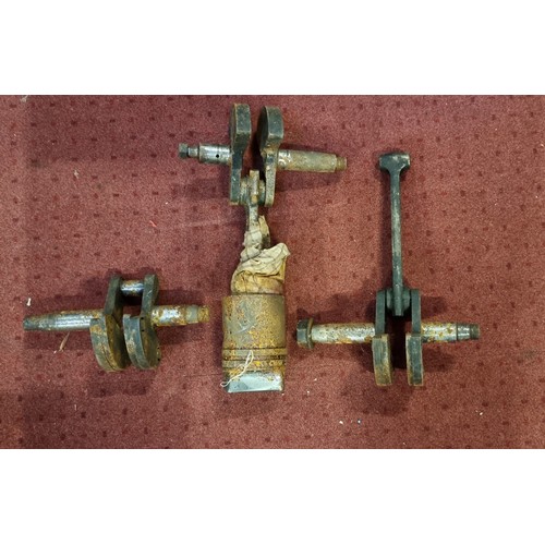 142 - A Levis 2 1/4 crankshaft, conrod and cast iron piston, another crankshaft with conrod and a cranksha... 