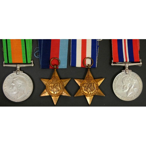 399 - WWII group of four, ribbons, Defense, 1939-1945 Star, France and Germany Star and a War medal, box w... 