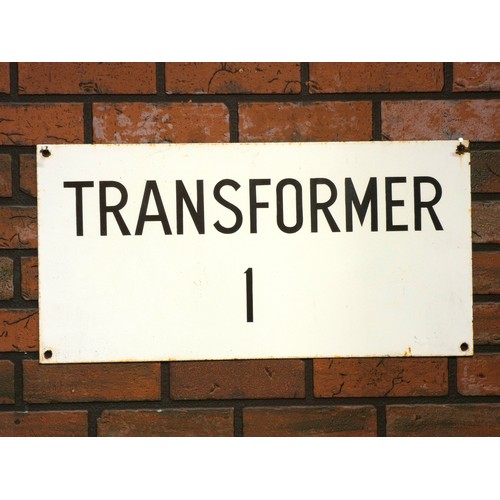 339 - An enamel Transformer One sign, single sided, 61.5cm x 30.5cm