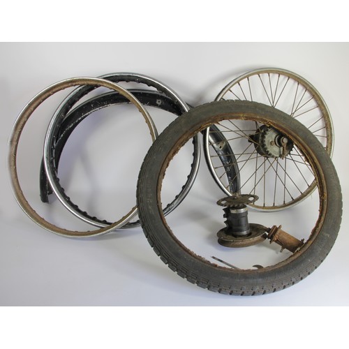 153 - A vintage chain and belt drive, together with a front hub, a rear wheel, two rims, a tyre and a mudg... 