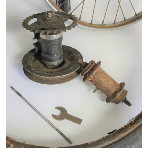 153 - A vintage chain and belt drive, together with a front hub, a rear wheel, two rims, a tyre and a mudg... 