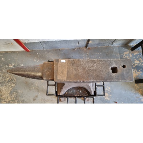 19 - An anvil, mounted on a purpose made stand, 69cm, clean tone when struck with a hammer.