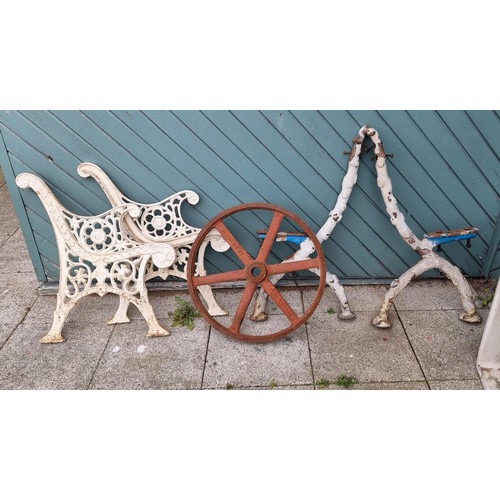 64 - A Victorian cast iron pair of branch pattern bench ends, an pair of cast iron floral bench ends and ... 