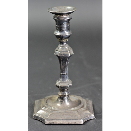 131 - A George II style silver taperstick, Sheffield 1893, of knopped form, 11.5cm, loaded, split beneath ... 