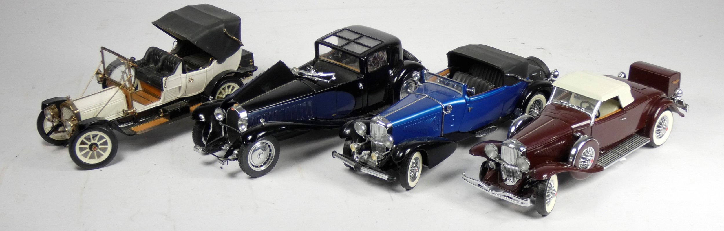 Four Franklin Mint 1:24 scale die cast car models, to include a