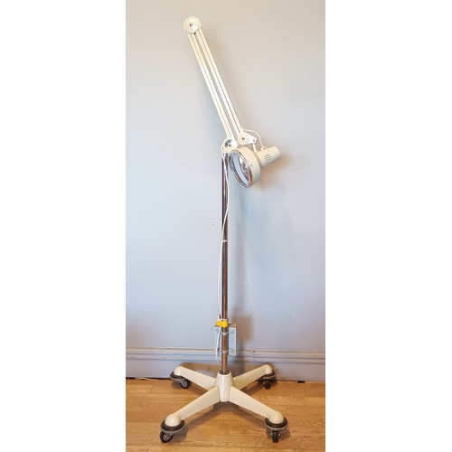 19 - A mid 20th Century floor standing anglepoise surgical lamp, made by Thousand And One Lamps Ltd, of B... 