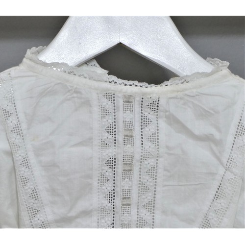 57 - White cotton embroidered christening gowns and cream embroidered layettes. Average 64cm length (9)