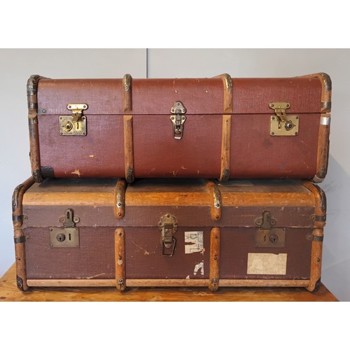 29 - Two beech bound traveling trunks, early 20th Century, having leather carrying straps, brass locks & ... 