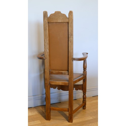 An Arts & Crafts style oak Shakespeare chair, high-backed bow