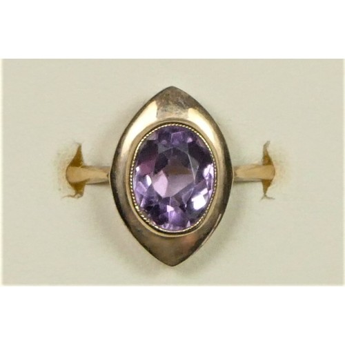 25 - A 9ct rose gold and amethyst dress ring, milligrain collet set with a mixed cut stone, Q, 3.5gm