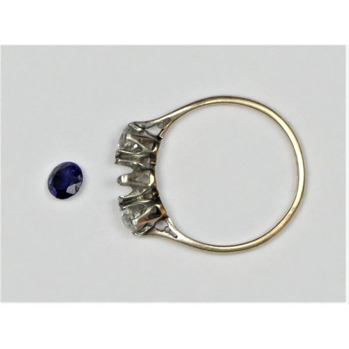 44 - An 18ct gold sapphire and diamond three stone, the mixed cut stone flanked by old diamonds of approx... 