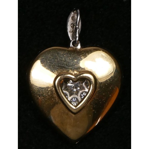 65 - A diamond set heart pendant, pave set with 43 brilliant cut stones, approximate weight 3.40cts, colo... 