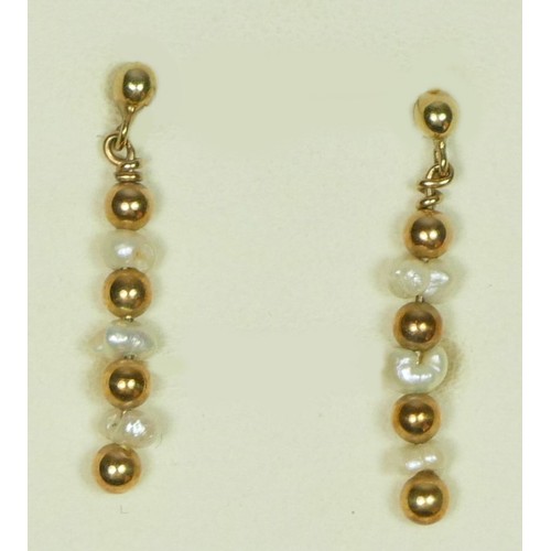 68 - A pair of rice pearl and 9ct gold ear pendants.