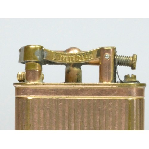 117 - Dunhill, a vintage gold plated lifting arm petrol lighter, dated 1925, with engine turned decoration... 