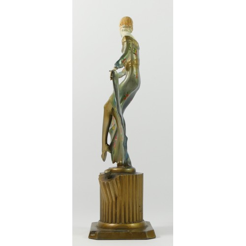 118 - An Austrian Art Deco table strike lighter, after Josef Lorenzl, cold painted spelter, depicting a da... 