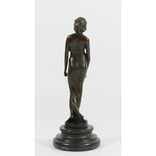 125 - A bronze figurine of a flapper girl holding a tray, on a stepped circular marble base.
19cm tall.