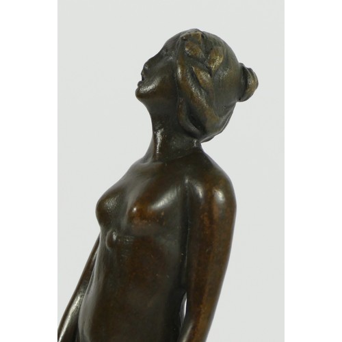 125 - A bronze figurine of a flapper girl holding a tray, on a stepped circular marble base.
19cm tall.