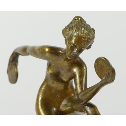 122 - A 20th Century brass figurine of a dancing flapper girl, stood upon a stepped circular marble base.
... 