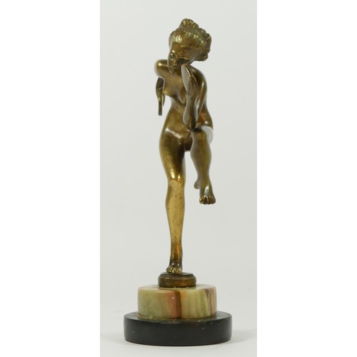 122 - A 20th Century brass figurine of a dancing flapper girl, stood upon a stepped circular marble base.
... 