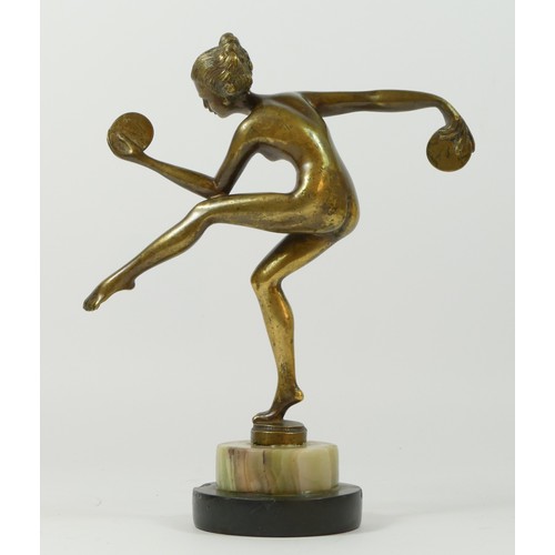 122 - A 20th Century brass figurine of a dancing flapper girl, stood upon a stepped circular marble base.
... 