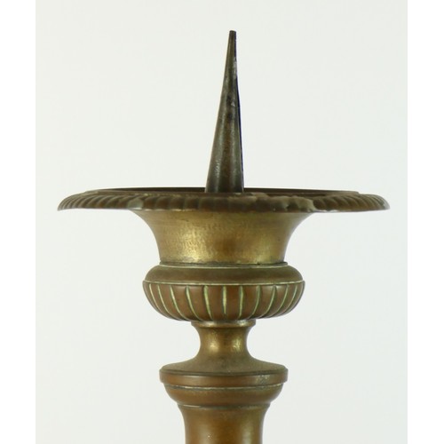 134 - A 19th century church altar pricket candlestick, impressed panels depicting Jesus, Mary and Sacred H... 