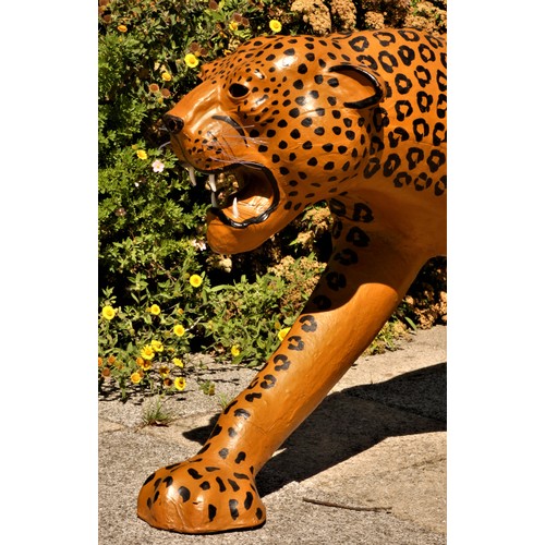 137 - A paper mache sculpture, in the form of a leopard, plastic teeth and whiskers, 100cm x 70cm x 30cm