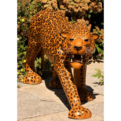 137 - A paper mache sculpture, in the form of a leopard, plastic teeth and whiskers, 100cm x 70cm x 30cm