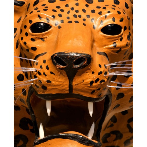 137 - A paper mache sculpture, in the form of a leopard, plastic teeth and whiskers, 100cm x 70cm x 30cm