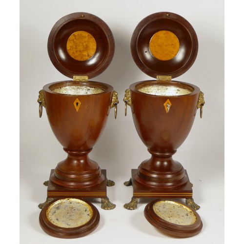 152 - A pair of George III style mahogany vase shape tea caddies, with boxwood and ebony inlay, lion mask ... 