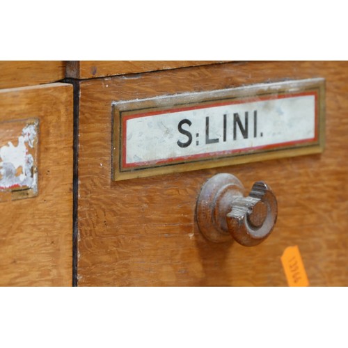 144 - A Victorian set of 30 Apothecary pitch pine drawers, most with the original glass medicine plaques, ... 