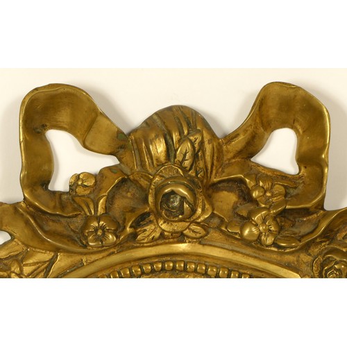 145 - A pair of cast brass Girondel wall mirrors, with ribbon and bow surmount, supporting three branches ... 