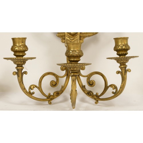 145 - A pair of cast brass Girondel wall mirrors, with ribbon and bow surmount, supporting three branches ... 