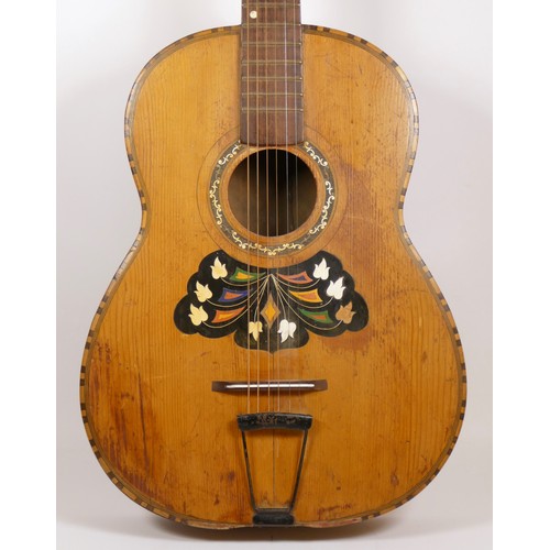 149 - A late 19th/early 20th century acoustic Continental guitar, with inset floral motif.