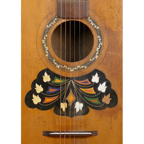 149 - A late 19th/early 20th century acoustic Continental guitar, with inset floral motif.