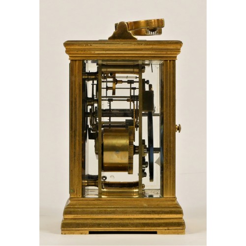 203 - A late 19th century brass striking carriage clock, Roman numerals, striking the hours and half on a ... 