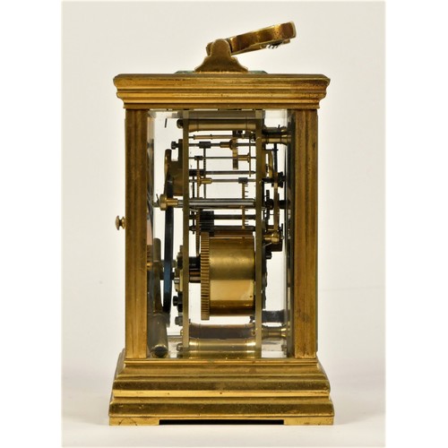 203 - A late 19th century brass striking carriage clock, Roman numerals, striking the hours and half on a ... 