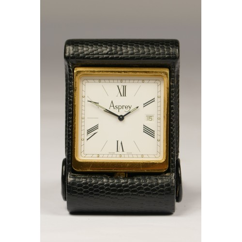 211 - Asprey, a leather folding travel alarm with date quartz clock, model 2576, 6.5 x 4.5 x 1.5cm.