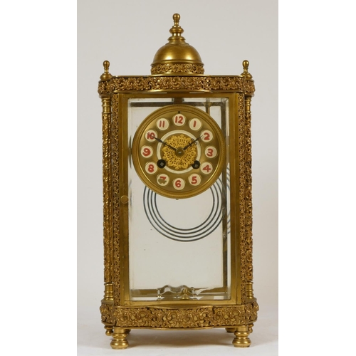 222 - A 19th Century French brass four glass and gilt metal eight day mantel clock, with ornate cast detai... 