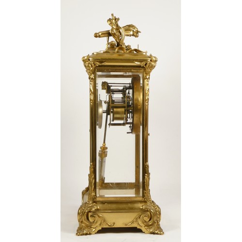 226 - Samuel Marti et Cie, Paris, a late 19th century brass four glass mantel clock, the white enamel two ... 