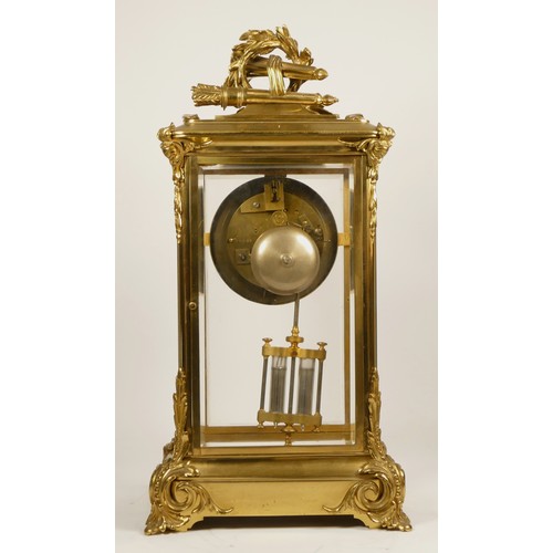 226 - Samuel Marti et Cie, Paris, a late 19th century brass four glass mantel clock, the white enamel two ... 