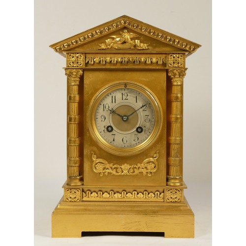 229 - Martie et Cie, Paris, a late 19th century French gilt brass mantel clock, silvered chapter ring, arc... 