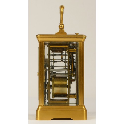 207 - A late 19th century brass striking carriage clock, Arabic numerals, striking the hours and half on a... 