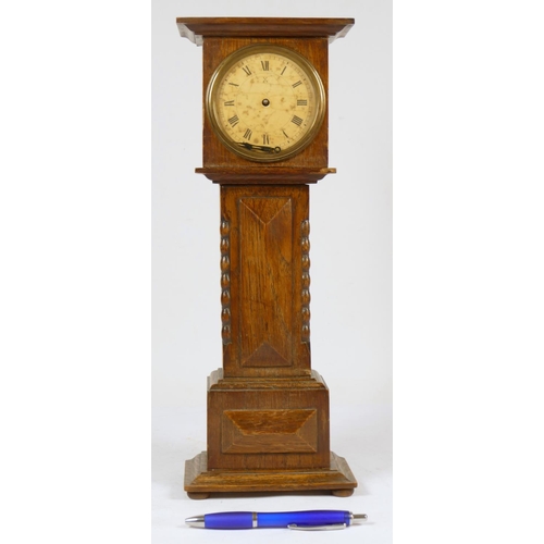 234 - A late 19th Century oak miniature longcase clock, by X.L the movement by Hamburg American Clock Comp... 