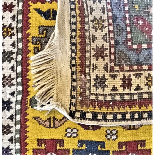 271 - A Turkish Konya runner, with guls on a yellow field, multi layered border, 295 x 85cm.
Sold with a p... 