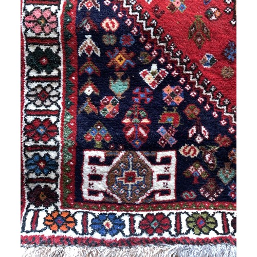 280 - A Persian Qashkai rug, 146 x 107cm and two other rugs.