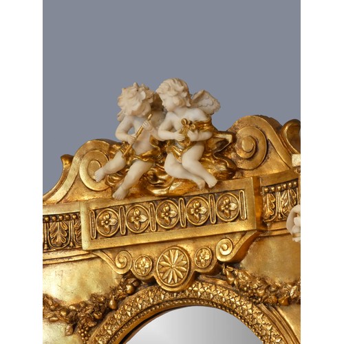 290 - An Italian Baroque style gilt resin and wood mirrored console table, the mirror with musical cherub ... 