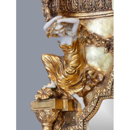 290 - An Italian Baroque style gilt resin and wood mirrored console table, the mirror with musical cherub ... 