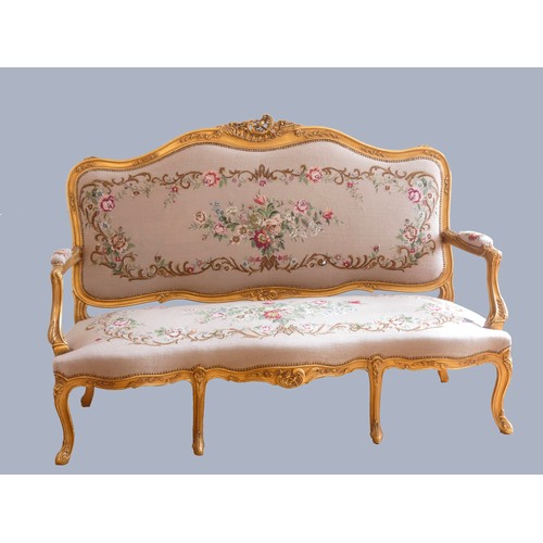 291 - A Louis XV style giltwood and petite point embroidered salon suite, comprising three seat sofa with ... 