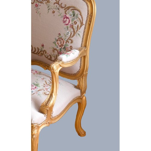 291 - A Louis XV style giltwood and petite point embroidered salon suite, comprising three seat sofa with ... 